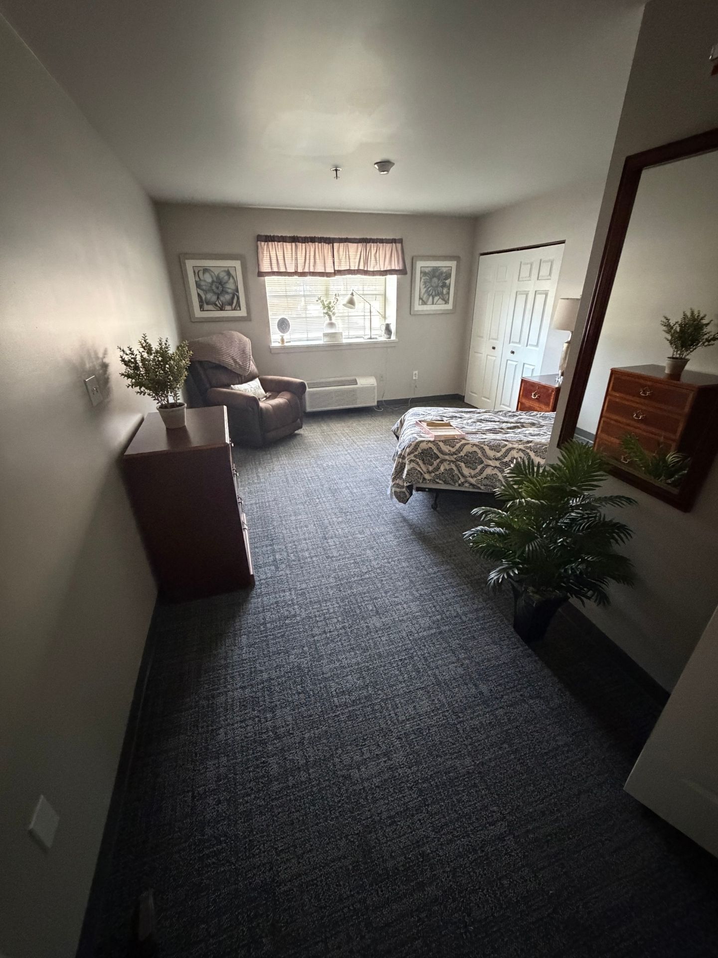 view of the entry and bedroom of a model room.